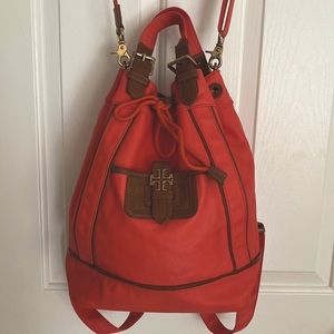Tori Burch Deep orange back pack with tan leather trim . Used